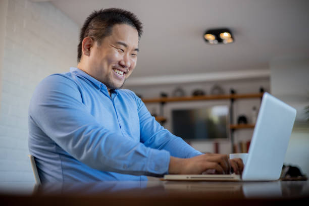 istock Young fashionable man working at home 1643254764