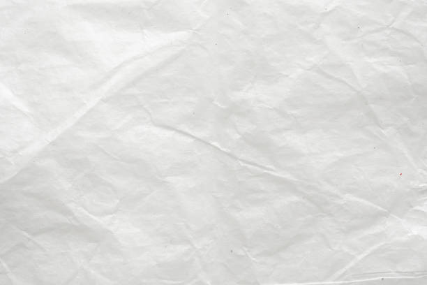 istock Abstract white crumpled and creased recycle paper texture background 1643256923