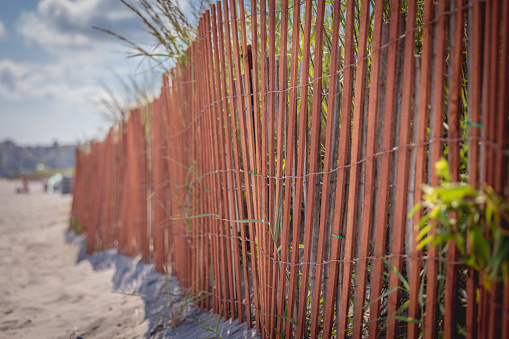 A wooden fence and beach in Rhode Island