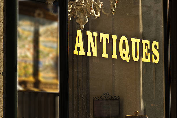 Antique store window sign wilth gold letters