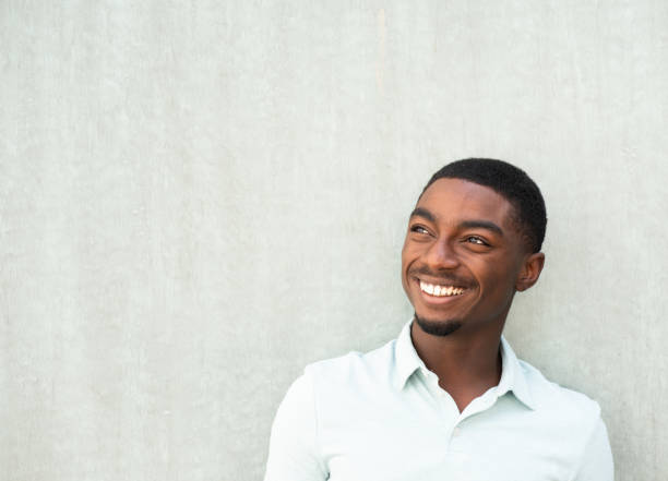 istock Close up handsome smiling young African American man looking away 1643274258