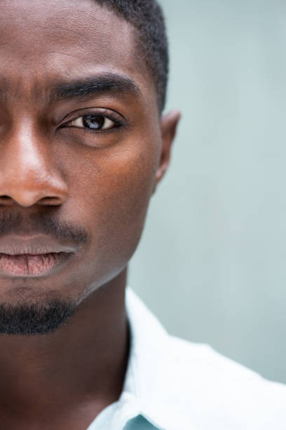 Close up portrait handsome half face African American man