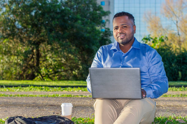 istock black entrepreneur with his notebook working in the park 1643284925
