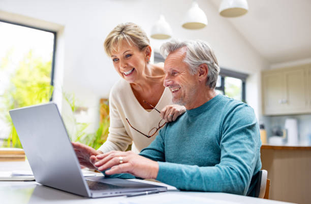istock Senior couple booking a reservation online 1643300515