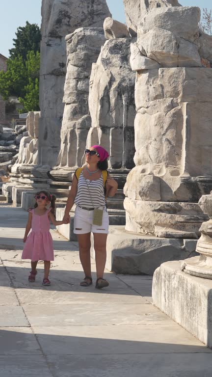 4K video of mother and daughter exploring ancient Greek City