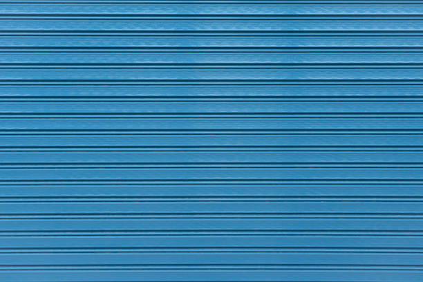 The Abstract of Blue Rolling steel door texture as background.