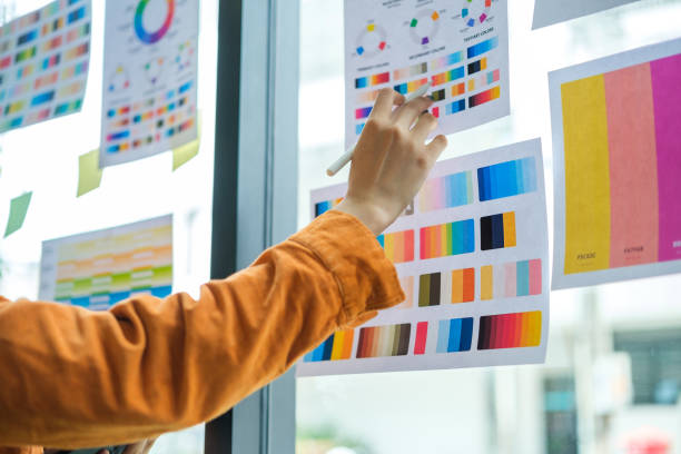 istock Interior designer working with color samples, choosing colorful paper charts. 1643341894
