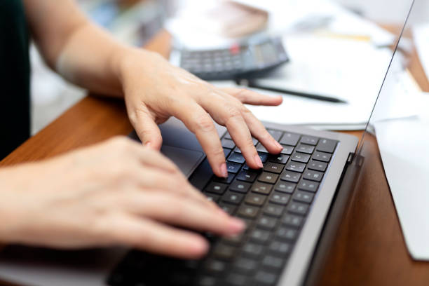 istock view of young woman doing paperwork manage financial documents 1643365479