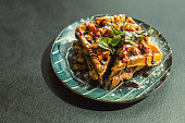 Waffle with chocolate and banana on plate