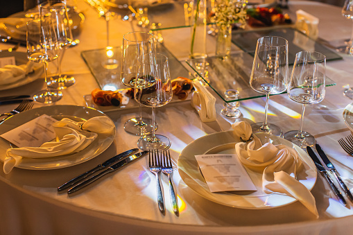 View above woman  and man sitting together on the table in restaurant interior. Dating and romantic dinner concept background. copy space.