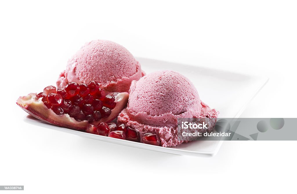 Pomegranate ice cream Fresh pomegranate ice cream on white background close up Close-up Stock Photo