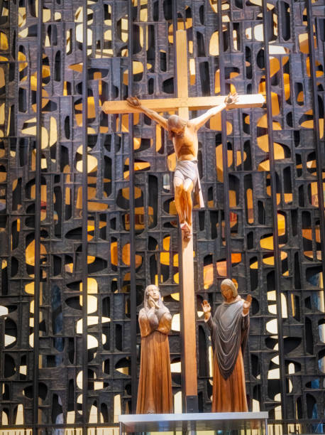 Decorated cross and candles inside a church.