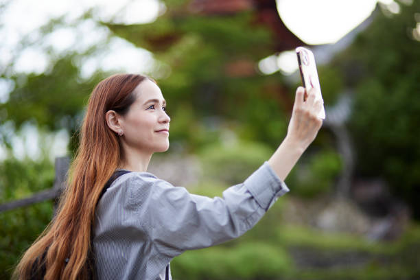 istock Foreign tourists enjoying travel 1643451248
