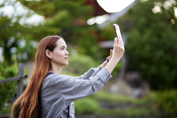 istock Foreign tourists enjoying travel 1643451353