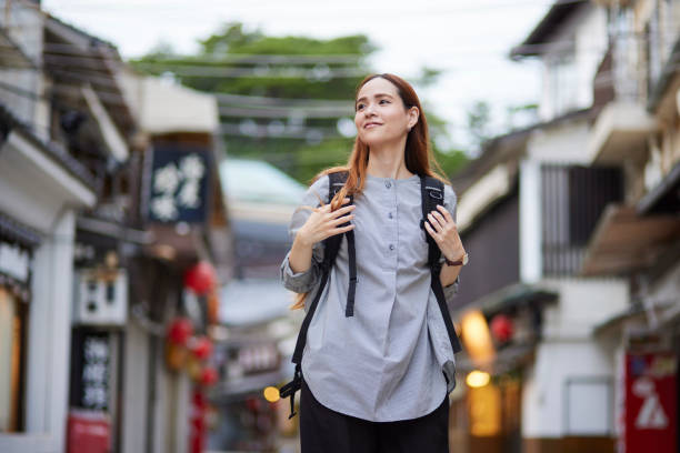 istock Foreign tourists enjoying travel 1643451399