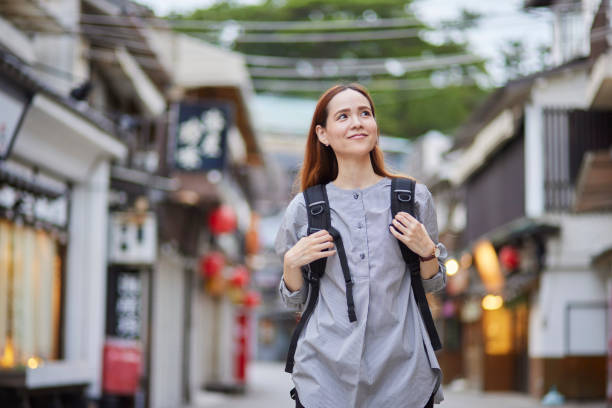 istock Foreign tourists enjoying travel 1643451441