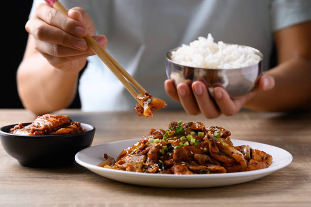 istock Korean stir fried kimchi cabbage with pork eating with kimchi and cooked rice 1643500115