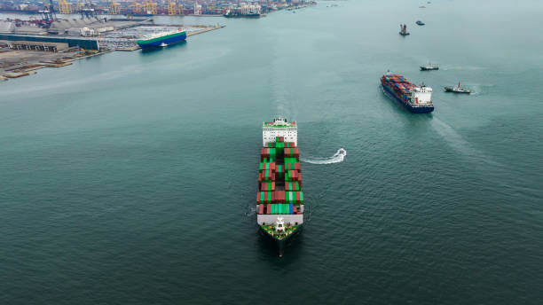 istock aerial front view cargo container ship carrying in sea import export goods and distributing products to dealer consumers, global business transportation by container ship open sea, 1643508102