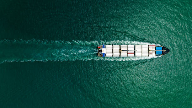 istock cargo container ship sailing full speed in sea to import export goods and distributing products to dealer and consumers worldwide, by container ship Transport business delivery service, aerial view 1643508624