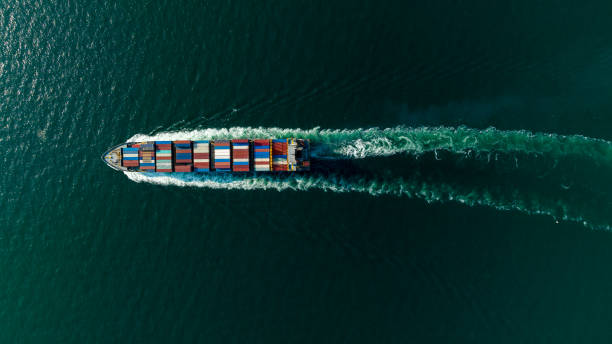 istock cargo container ship sailing full speed in sea to import export goods and distributing products to dealer and consumers worldwide, by container ship Transport business delivery service, aerial view 1643508625