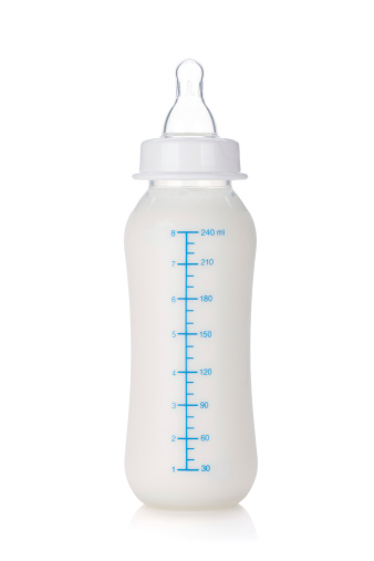 Baby bottle with milk, isolated on white background.