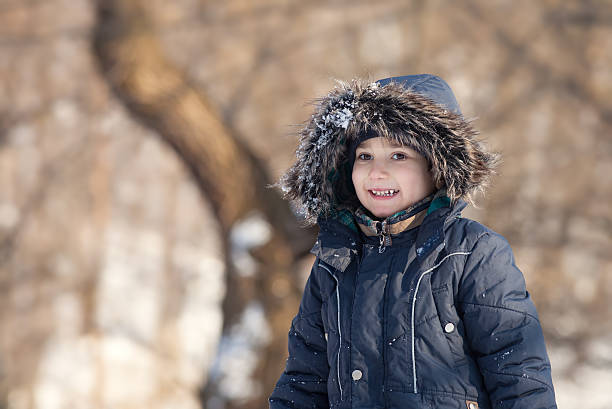 istock Cute boy in the winter park 164352502