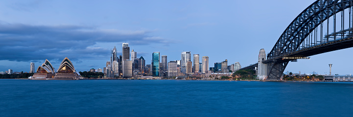 Wide angle panoramic view of Sydney city skyline in the pre dawn light of a new day.