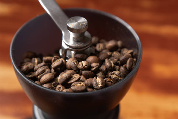 istock Roasted coffee beans in a coffee grinder 1643574514