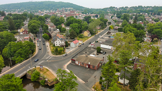 Community crossroads in smog from Canadian fires: A fork in the road emerges among the streets and hills of the small community of Ephrata, PA.