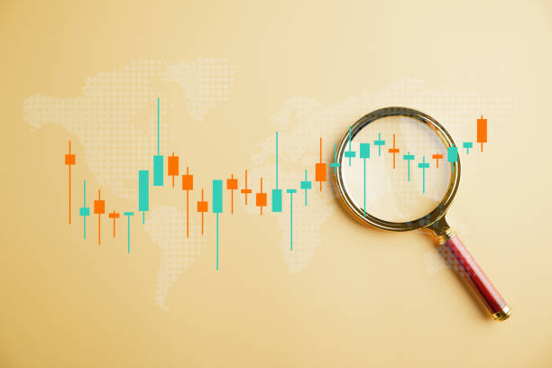 istock Magnifier glass focuses on the bar graph with an increasing arrow 1643599348