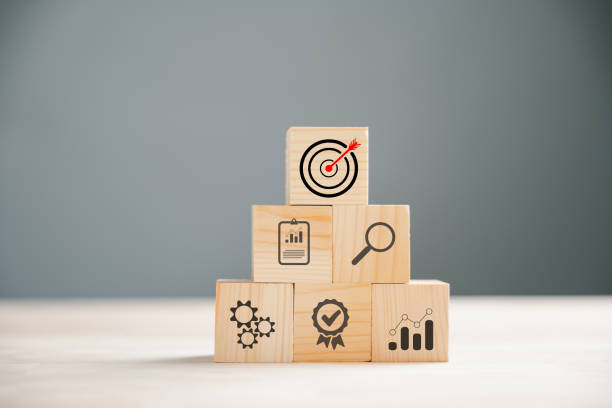 istock Wooden block cude step on table with Action Plan 1643599355