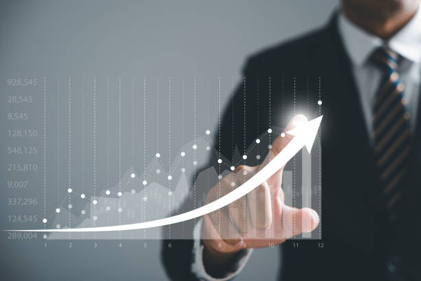 istock Businessman pointing arrow graph growth and financial network connection 1643599382
