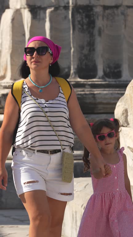 4K video of mother and daughter exploring ancient Greek City