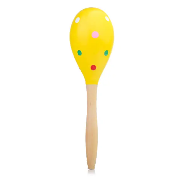 Wooden colored baby rattle isolated on a white background. Bright maracas for a child. Toys for concentration of attention.