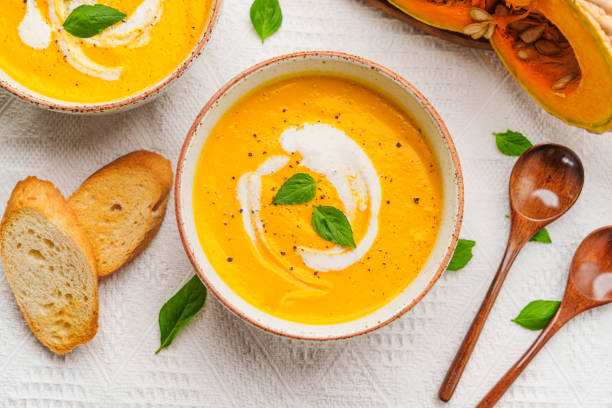 istock Pumpkin Soup with Cream and Bread 1643625909