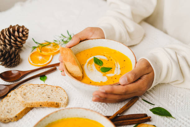 istock Pumpkin Soup with Cream and Bread 1643626453
