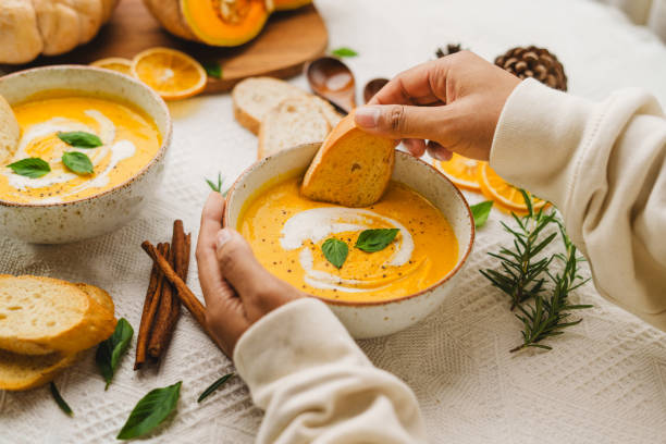 istock Pumpkin Soup with Cream and Bread 1643626761