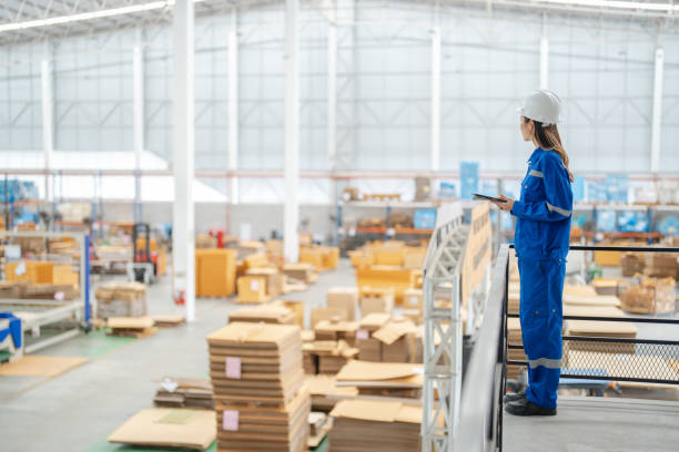istock Efficient Manufacturing Machinery Quality Check by Female Engineer in Printing Plant Machinery 1643646663