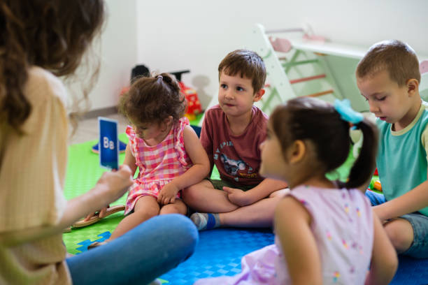 istock kids with teacher in day care 1643671525