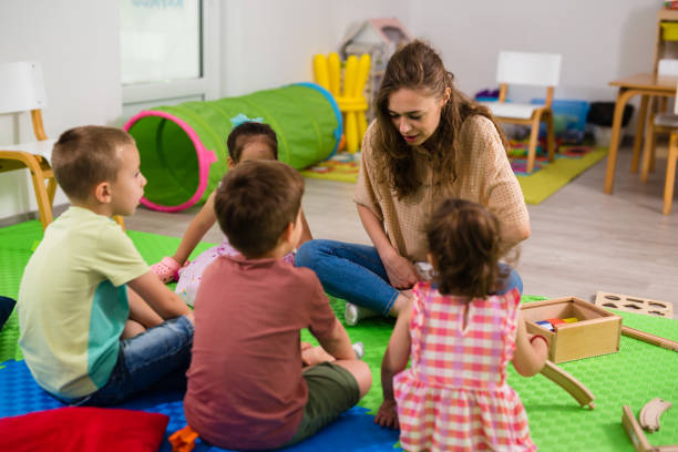 istock kids with teacher in day care 1643671529