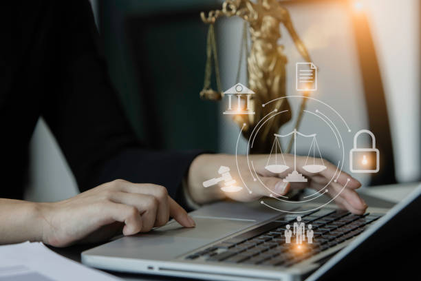 istock Lawyer man using laptop at office desk. 1643686968