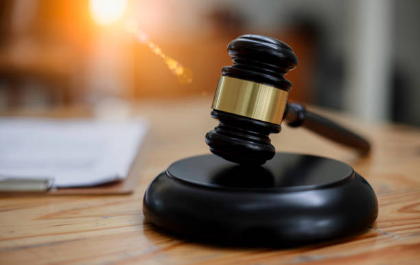 istock Wooden gavel  on office desk. 1643687582