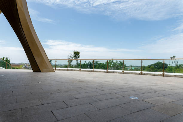 istock empty concrete floor with cloudy sky and landscape. 1643695762