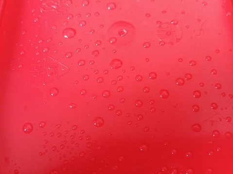 water droplets on a red background