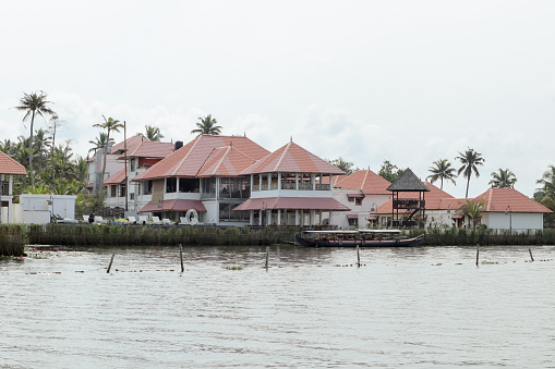 Kochi, Kerala, India-October 9 2022; A Traditional Eco friendly Architectured building with tiled roofs built in Kerala style on the banks of Kochi ocean in India.