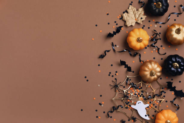 istock Halloween holiday background with party decorations from pumpkins, bats, spider web and ghosts top view. Happy halloween greeting card flat lay. 1643737738