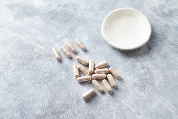 istock Carnitine capsules. Concept for a healthy dietary supplementation. Bright stone background. Soft focus. Copy space. 1643764770