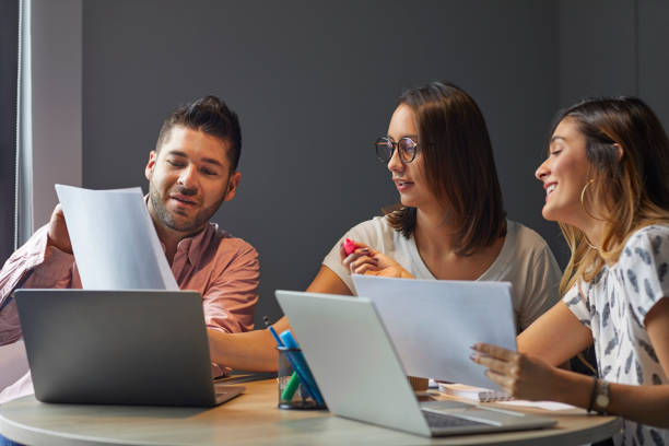 istock Business professionals discussing in meeting 1643777392