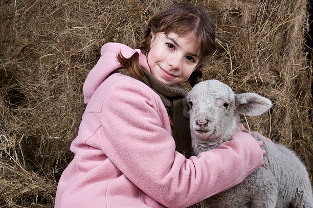 istock Girl with a lamb close 164378154