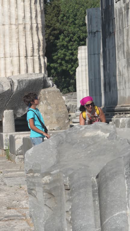 4K video of mother, son and daughter in ancient Greek city ruins